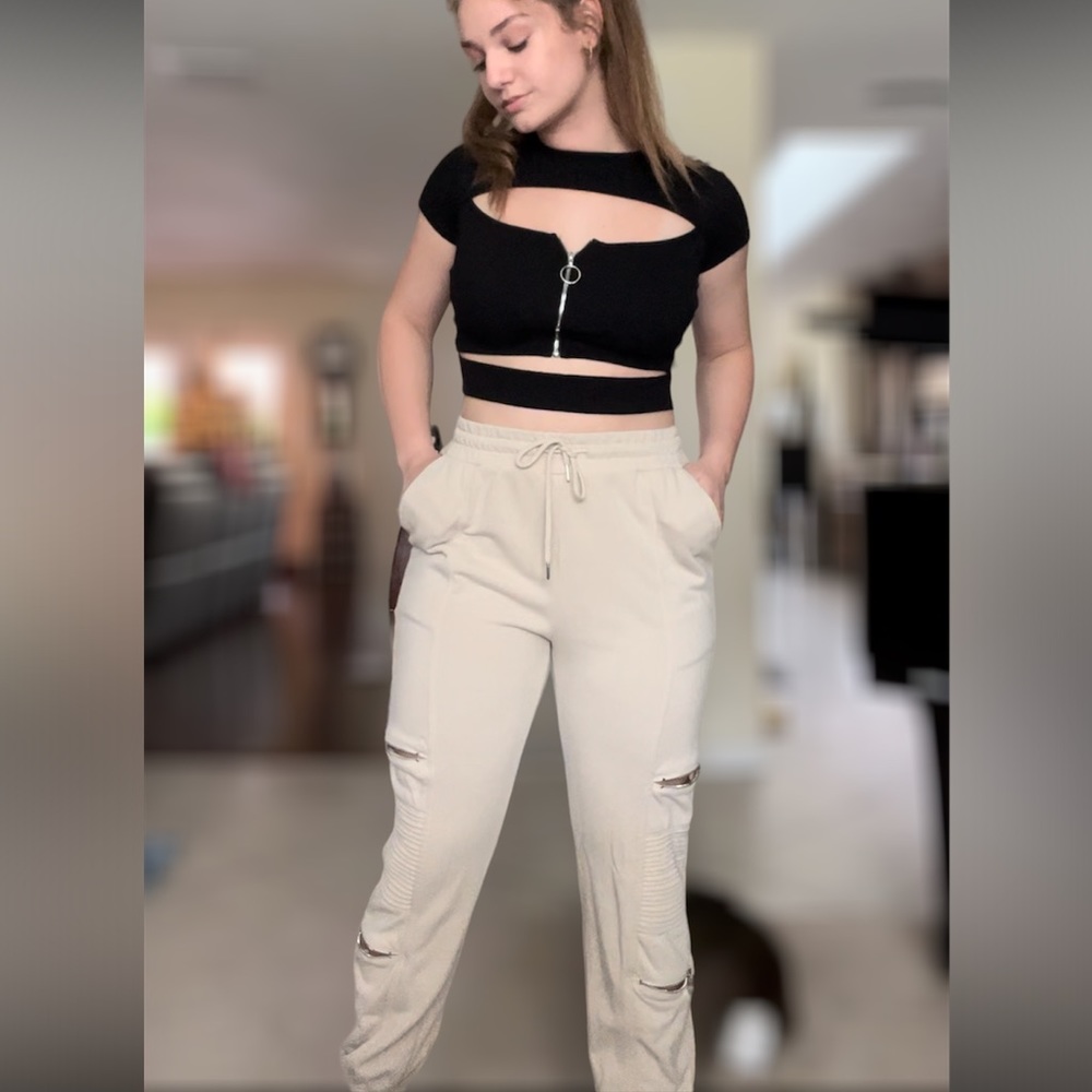 Cream sweat pants with zippers on legs